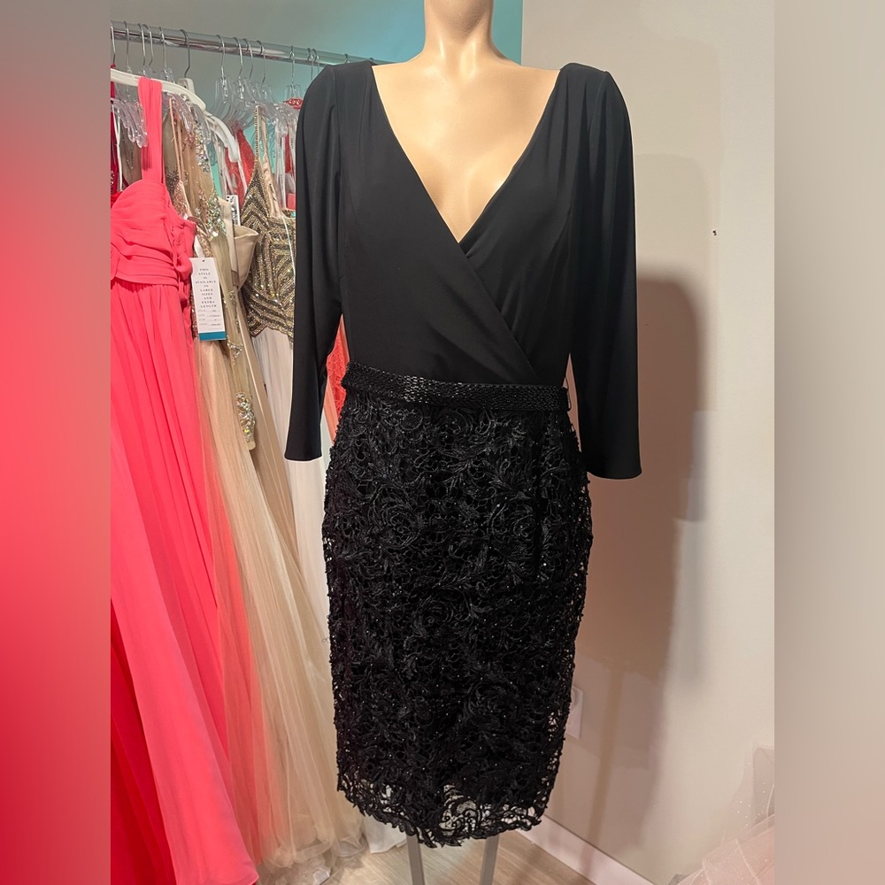 Black V Neck ¾ sleeve with black lace skirt and beaded belt. Size 14.